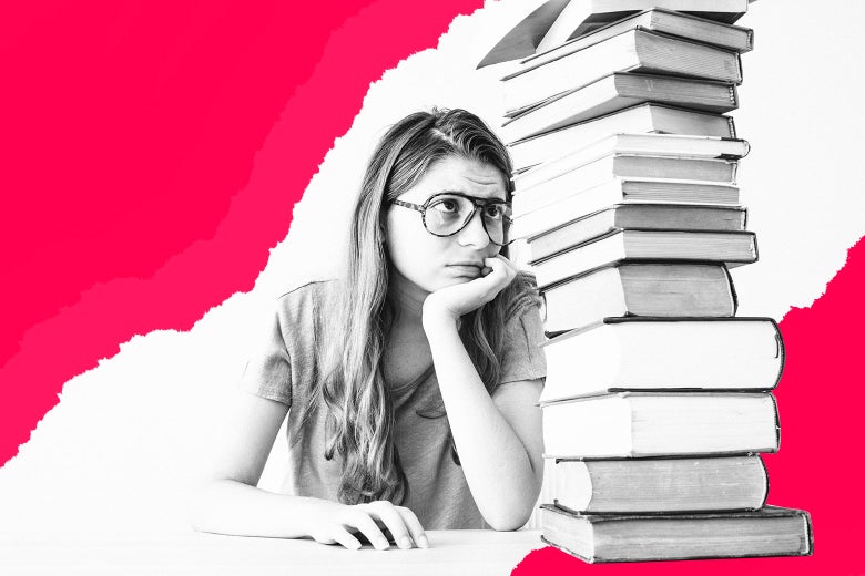 Student looking anxious in front of pile of books.